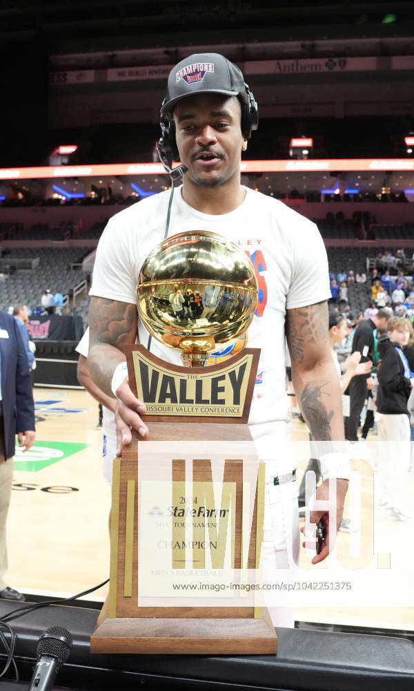 Drake s Darnell Brodie admires the team trophy as he does a radio