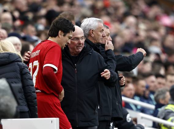 Football - 2024 Liverpool Foundation Charity - Liverpool Legends vs Ajax Legends - Anfield - Saturday 23rd March 2024 Liverpool Legends manager Sven-Goran Erikssen brings on Jari Litmanen