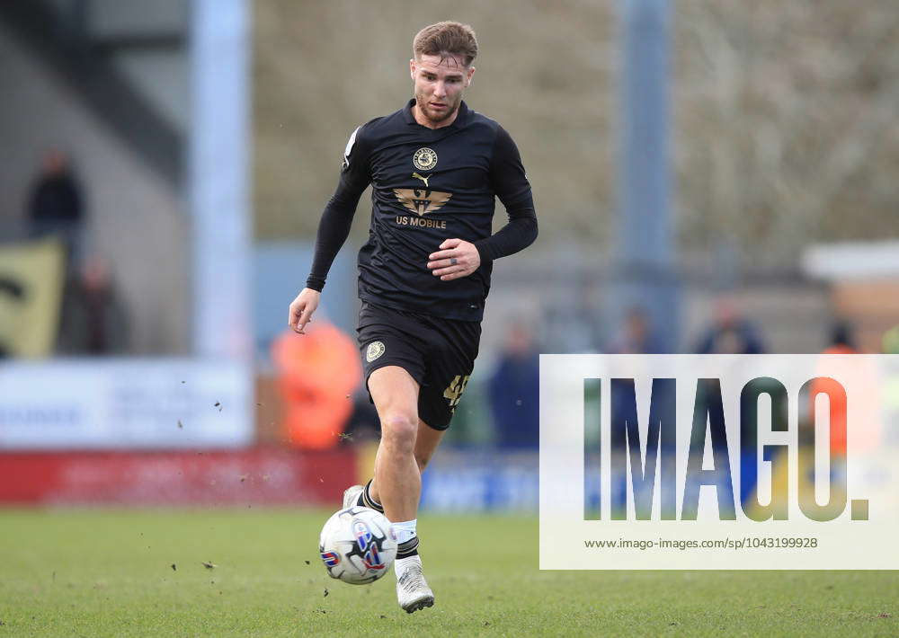 Luca Connell of Barnsley scores their second goal against Burton