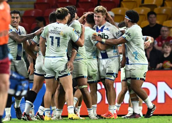 SUPER RUGBY REDS BLUES, Blues players celebrate the winning try to Sam ...