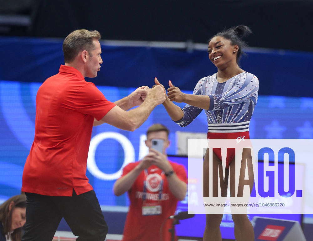 June 28, 2024: Simone Biles fist bumps her coach, Laurent Landi, following  her Yerchenko Double