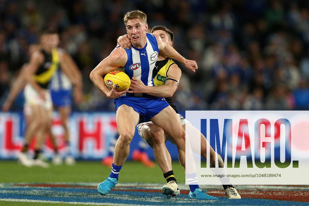 Dylan Stephens AFL KANGAROOS TIGERS, Dylan Stephens of the Kangaroos is tackled during ...