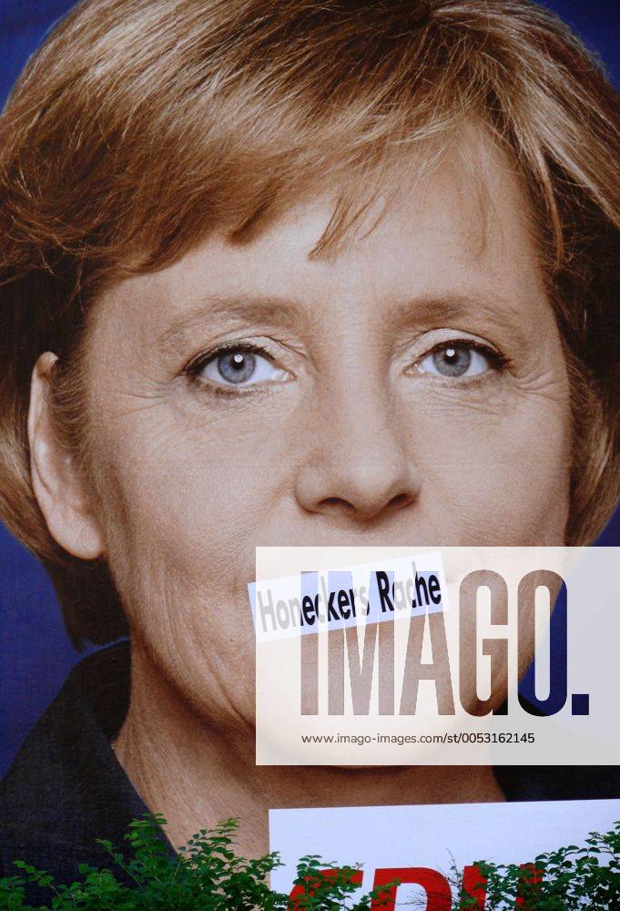 Schriftzug Honeckers Rache im Konterfei der Bundeskanzlerin Angela