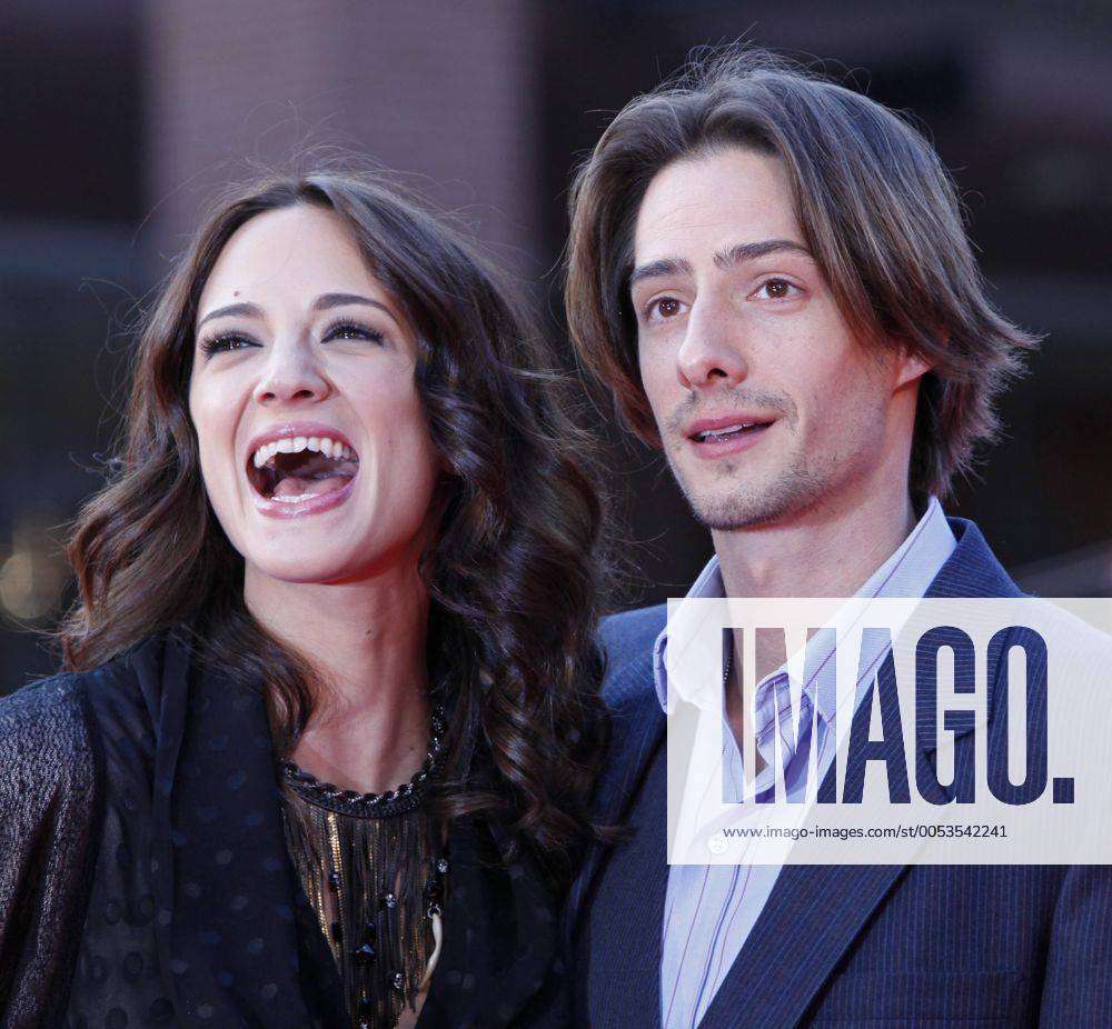 Asia Argento (L) and husband Michele Civetta arrive on the red carpet ...