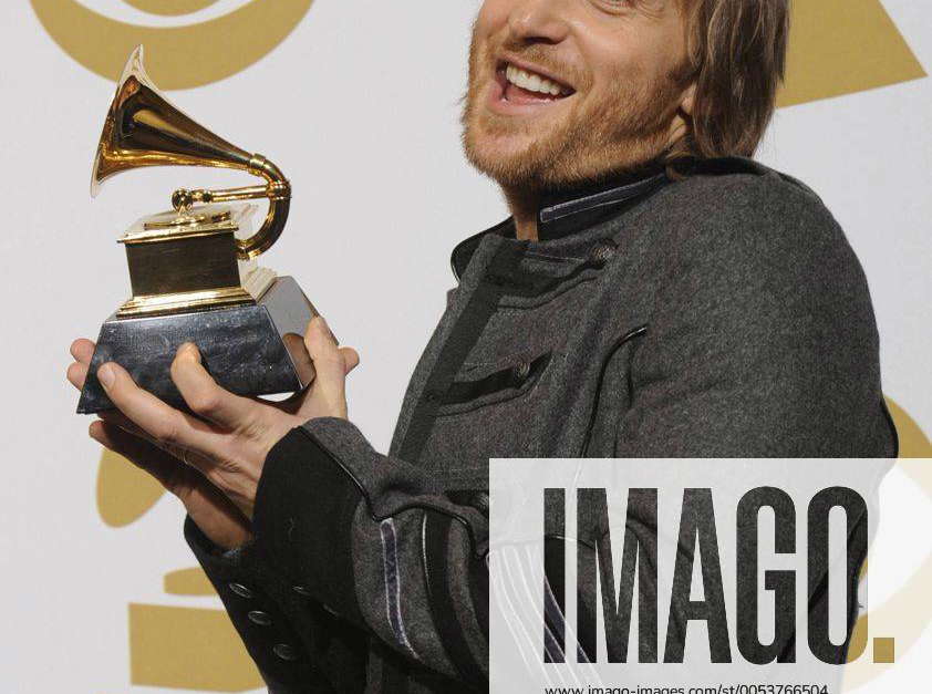 David Guetta holds his Grammy award for best remixed recording at the