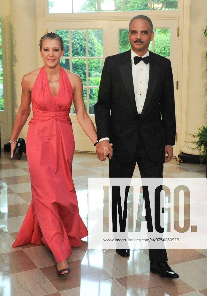 U.S. Attorney General Eric Holder and his wife Dr. Sharon Malone arrive