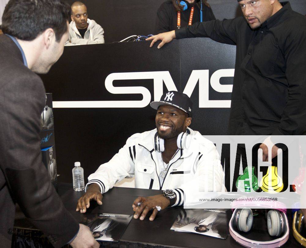 Sms The Rapper Rapper 50 Cent signs autographs in the SMS Audio booth at 2012 ...