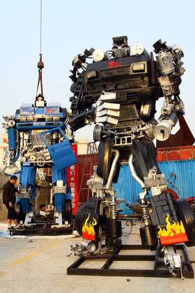 A worker welds a Transformer sculpture in Jiaxing, east Chinas Zhejiang ...