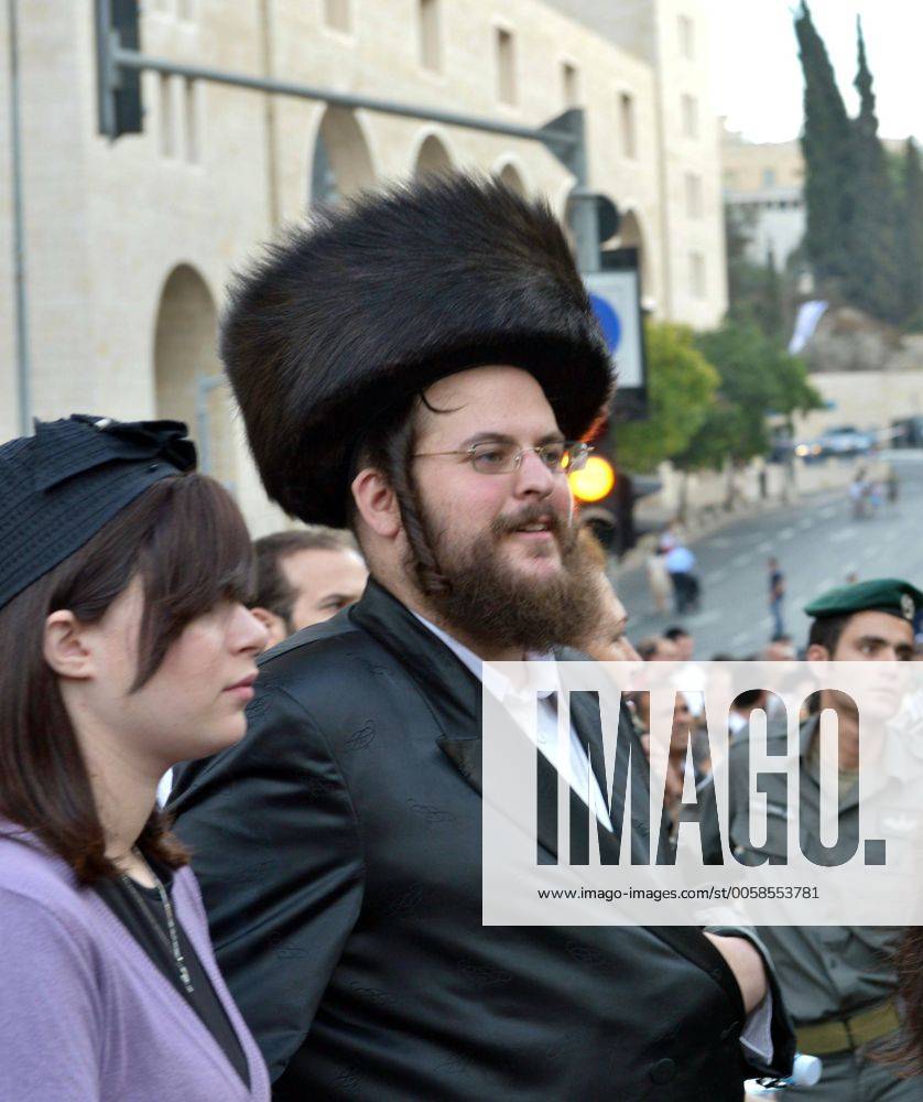 An ultra-Orthodox Jew watches the Jerusalem March on Oct. 4, 2012 ...
