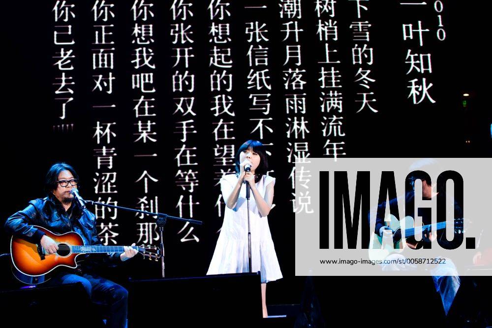 Famous pop song composer Gao Xiaosong (1st L) and singer Zhou Ziyan (C ...