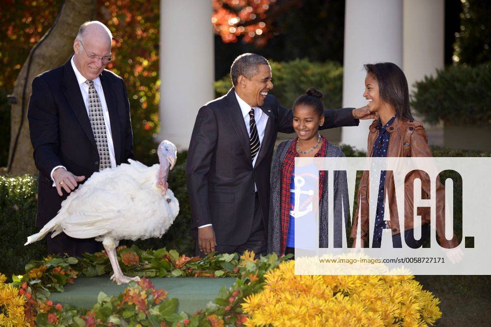 President Barack Obama Shares A Laught With His Daughters Sasha R And