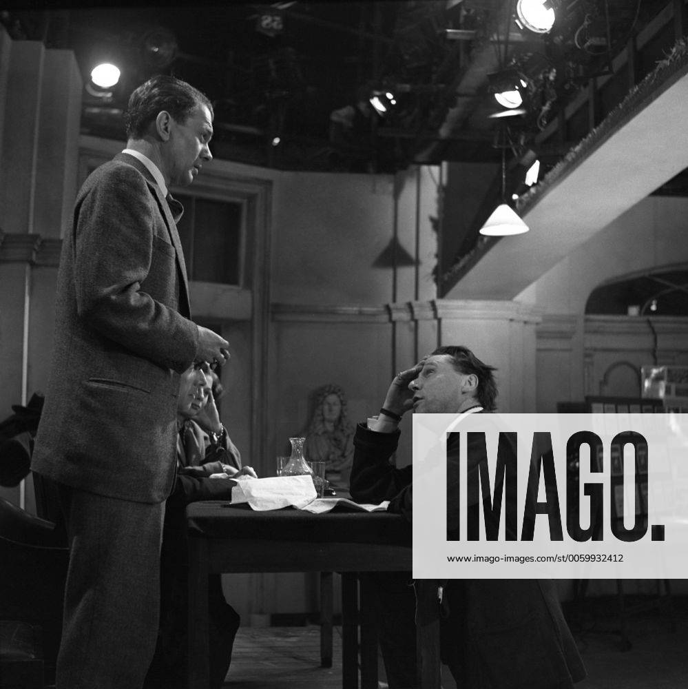 British film director, Carol Reed, talks to American actor Joseph ...