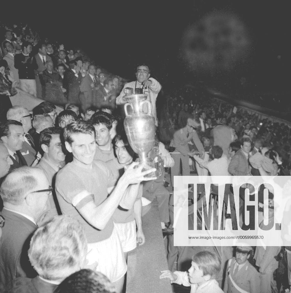 Italian soccer player Giacinto Facchetti holds the European Nations Cup