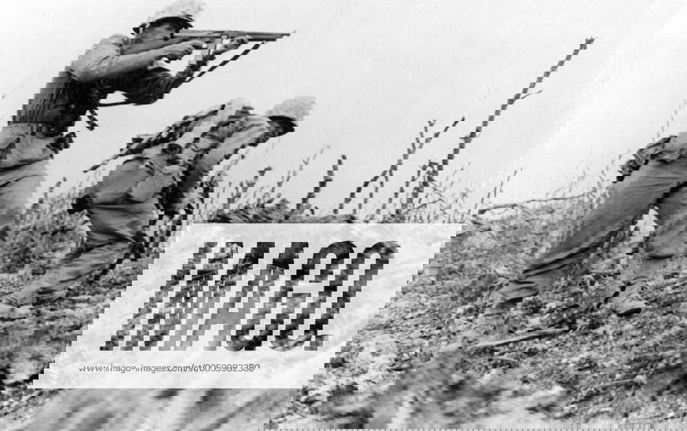 Marine sights in on a Japanese sniper , on Wana Ridge , Okinawa