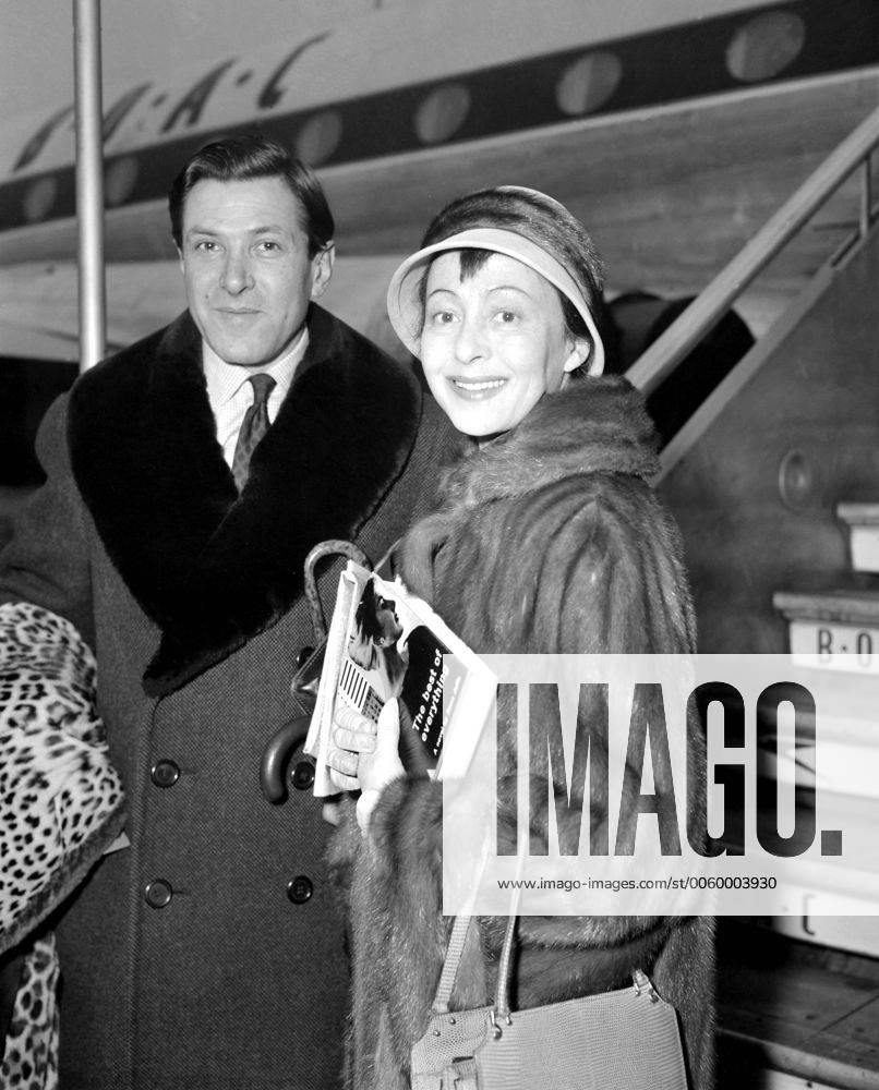 London, Publisher Robert Knittel and his actress wife Luise Rainer at  London Airport before flying