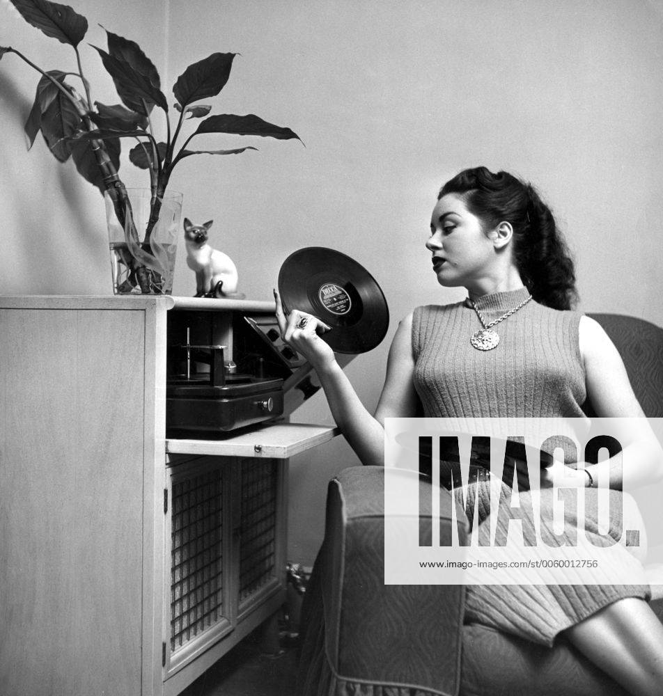 Jean Carmen seen making a selection from her record collection to play ...