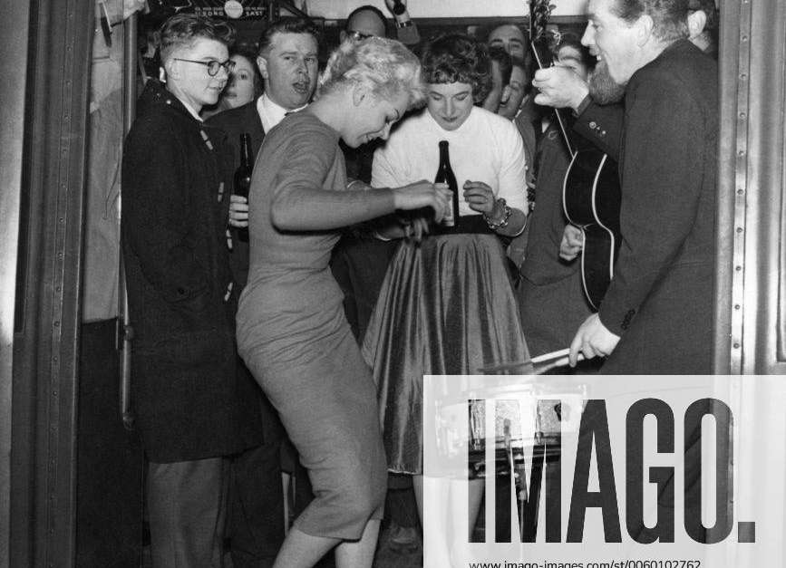 Party on a tube train. Starlet Joy Webster performs the rock and roll ...