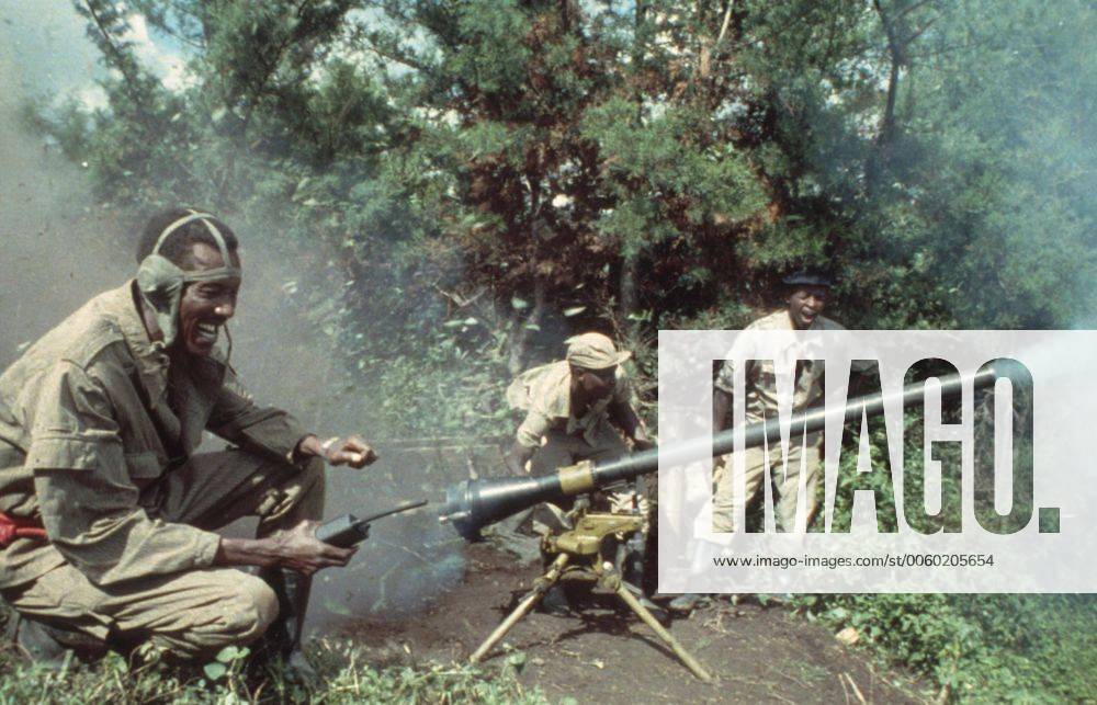 Rwandese patriotic front rebel soldiers fire a mortar at government ...