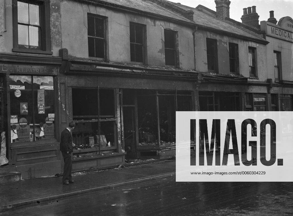 The burnt - out remains of shops in Swanscombe , Kent after a fire