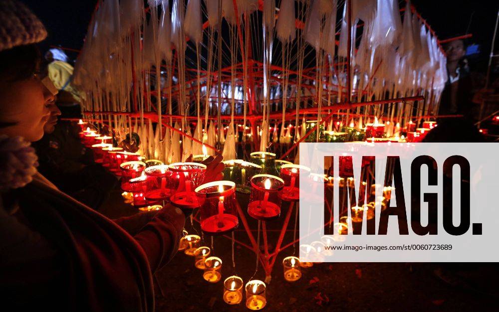 People light candles during the Tazaungdaing Festival in Taunggyi ...