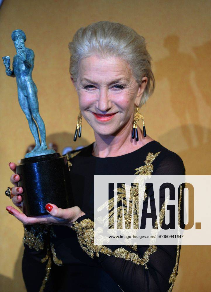 Actress Helen Mirren holds the award she won for Best Female Actor in a