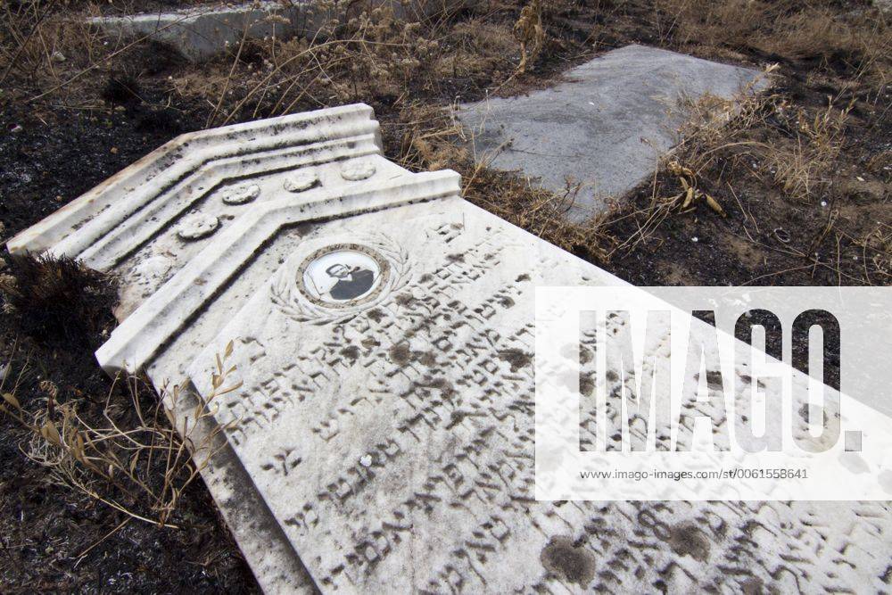 Fallen headstone with inscription in Hebrew, abandoned Jewish cemetery ...