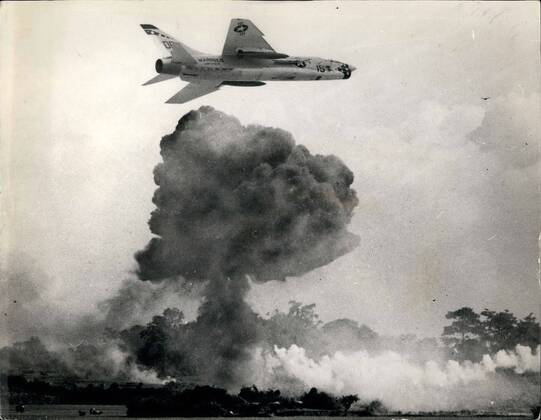 Jan. 01, 1966 - The war in Vietnam: Winging past a bomb explosion from ...