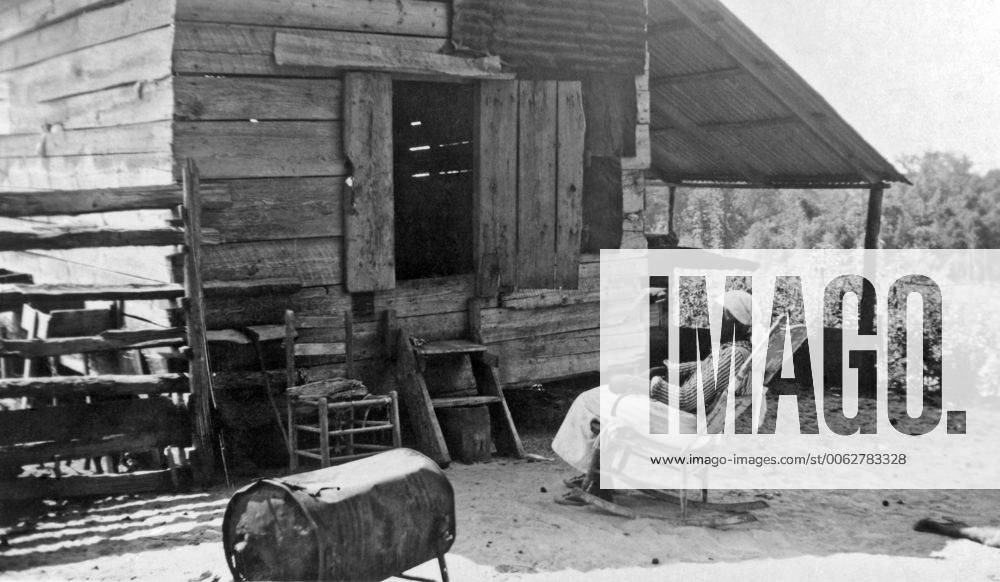 American South: c. 1938. Julia Ann Jackson, age 102, and the corn crib ...