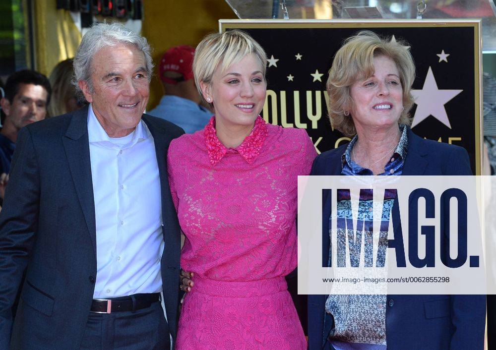 Actress Kaley Cuoco (C) poses with her father Gary Carmine Cuoco and
