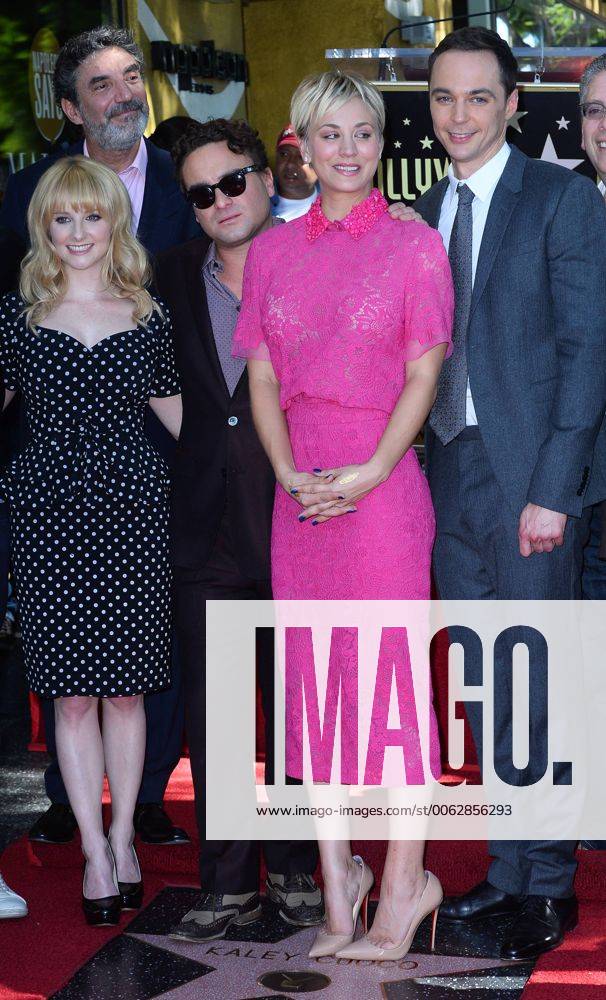 Actress Kaley Cuoco, pink dress, poses with The Big Bang Theory cast ...