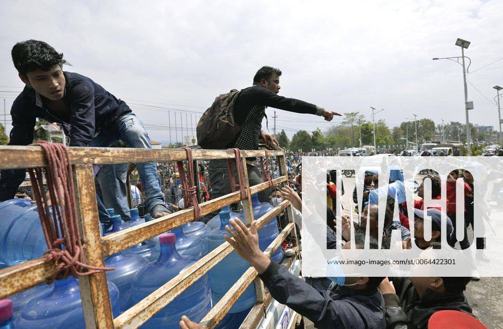 Evacuees in Kathmandu rush for water Evacuees in Kathmandu try to obtain bottles of water from a