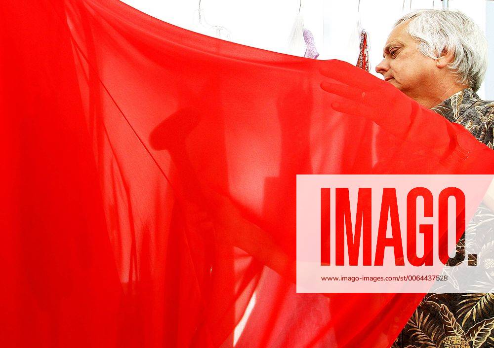 April 30, 2015 Moline, Iowa, U.S. Kim Breecher steams a prom dress