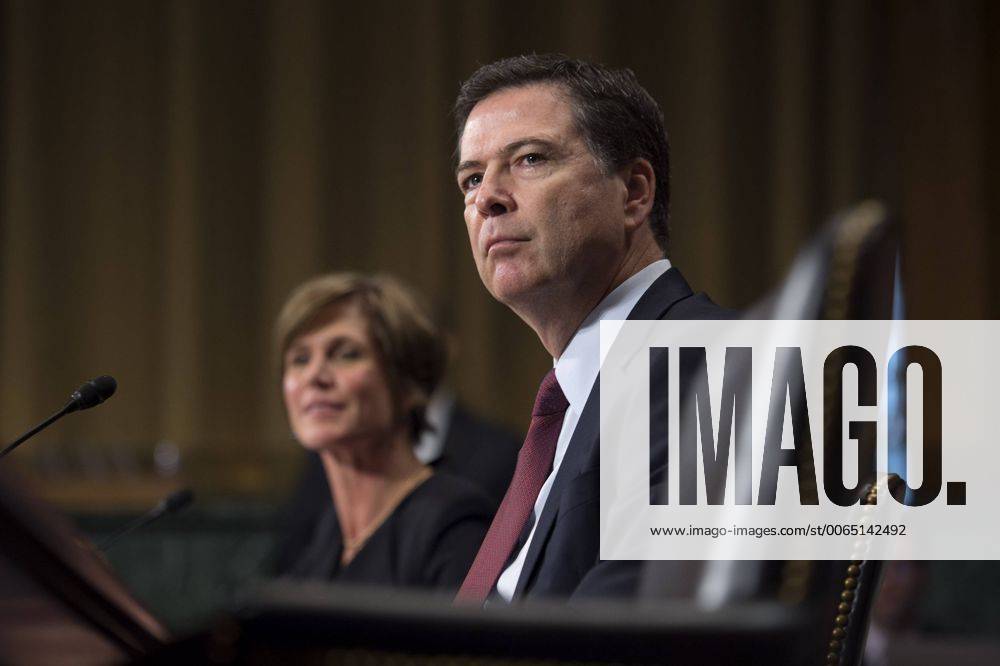 FBI Director James Comey (R) And Deputy Attorney General Sally Quillian ...