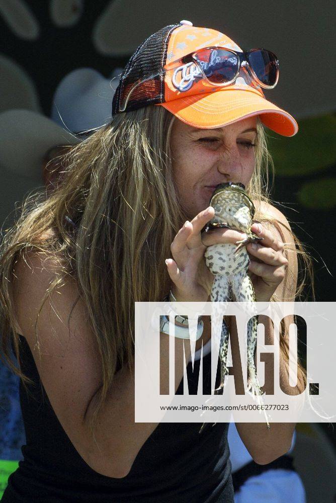 May 18, 2014 Angels Camp, California, U.S. Eugenie Wilcocks kisses a frog before jumping it duri