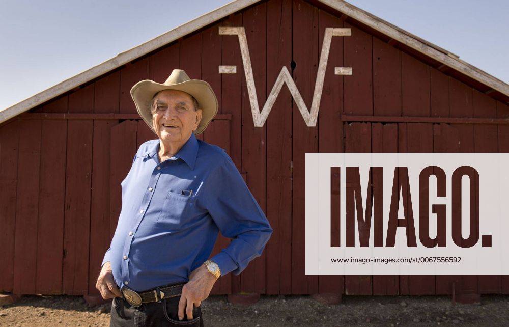 May 2, 2013 Cal Worthington stands in front of one of his barns on