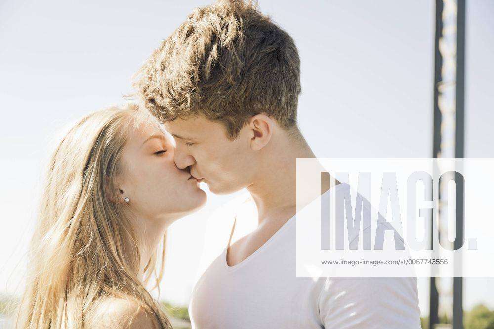 Young couple kissing model released Symbolfoto Y