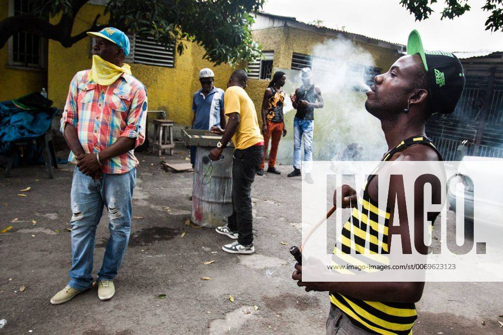 Jun 23, 2015 - Kingston, Jamaica - Rastaman smokes chalis and other ...