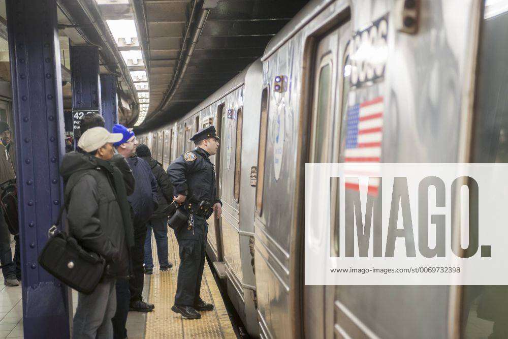 Nypd Effort To Combat Spike In Crimes In New York Subway An Nypd Officer During An Investigation In