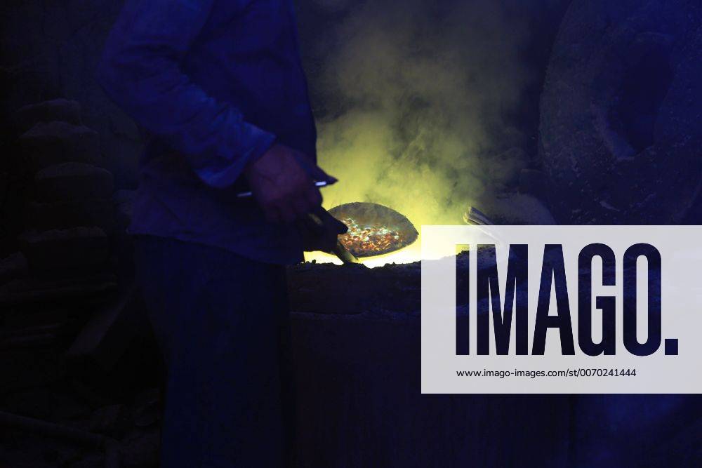 ALEXANDRIA, -- A worker melts scrap metal inside the furnace at a scrap ...