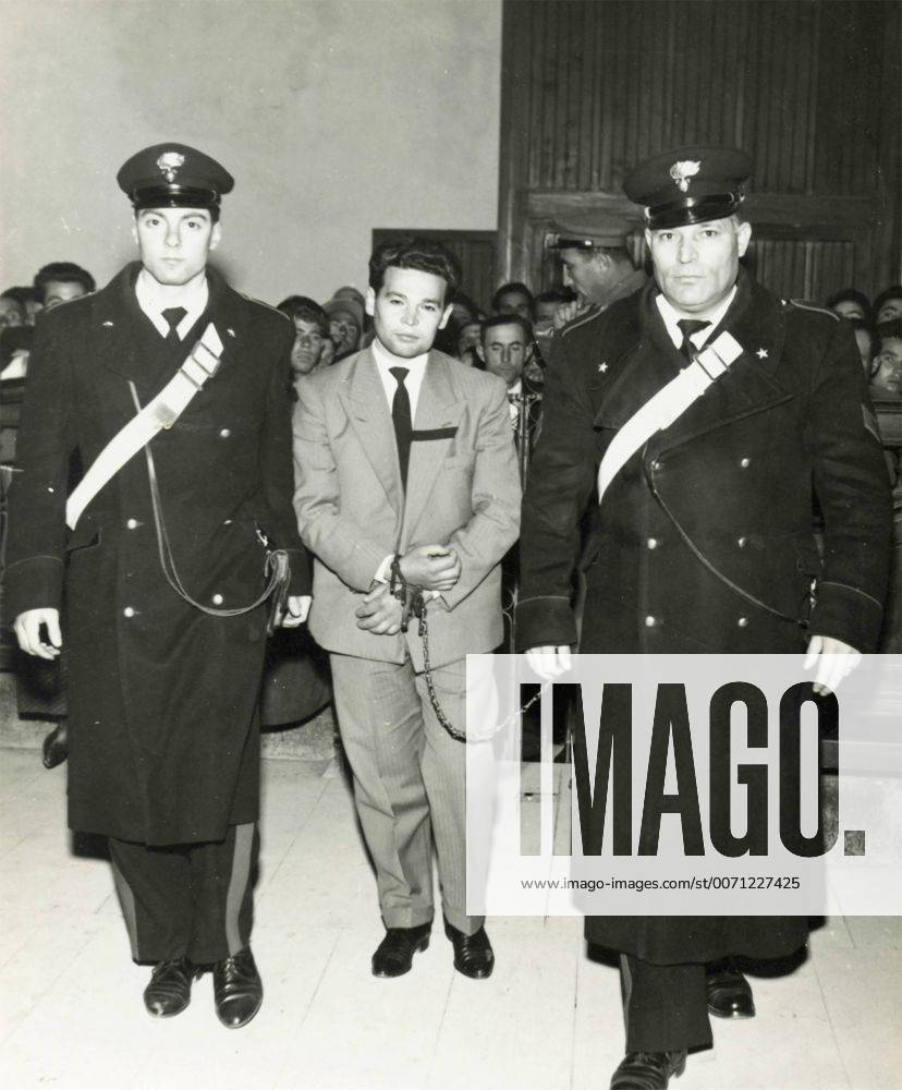 Sentenced man escorted in handcuffs by the Italian Carabinieri , Italy