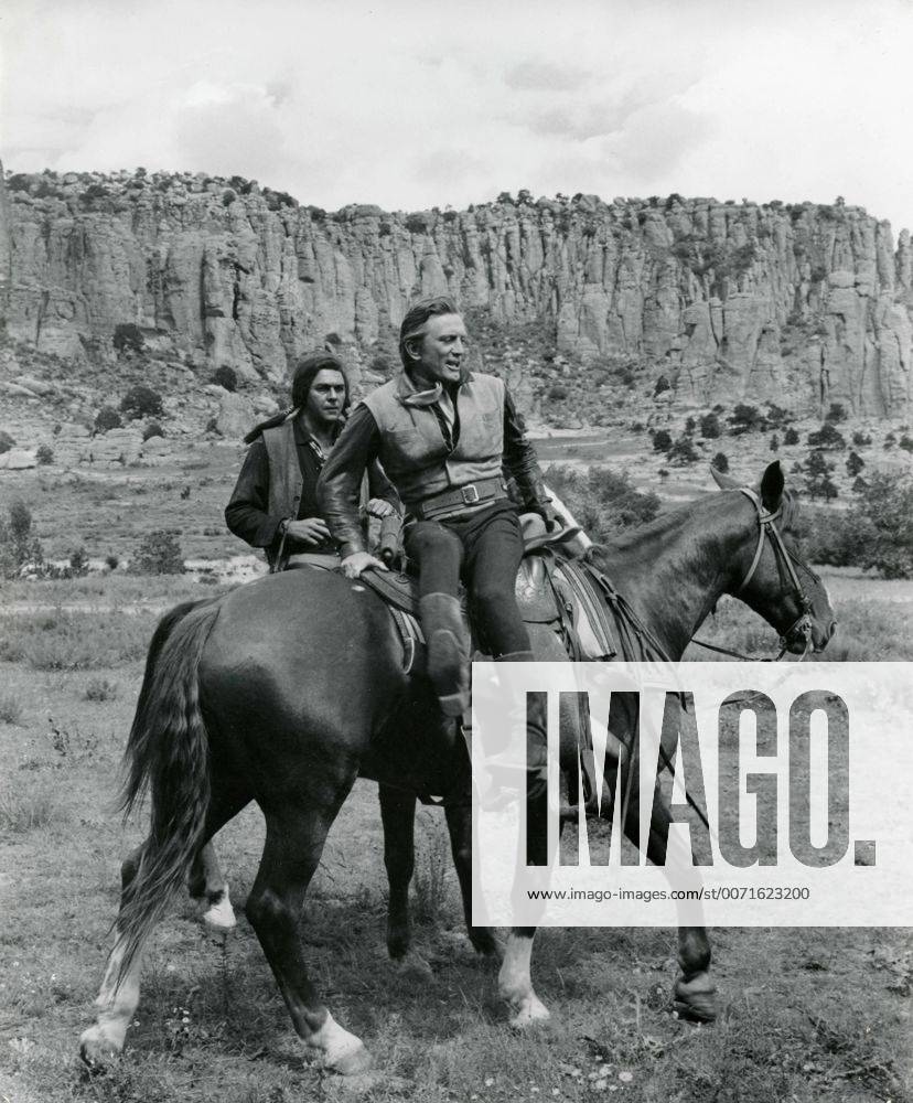 The actors Kirk Douglas and Howard Keel in a scene from the film The