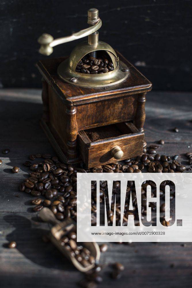 Grinding coffee with vintage coffee mill