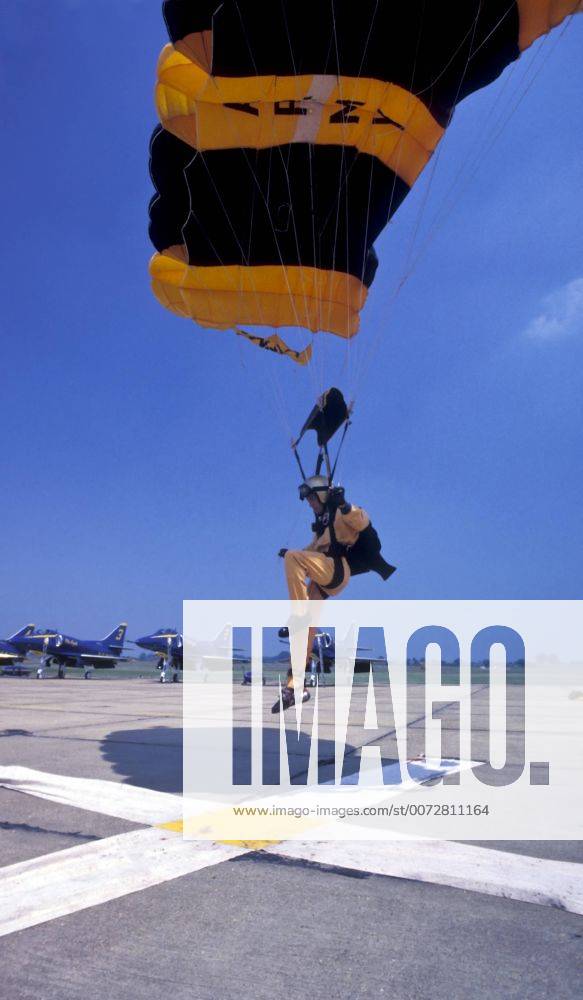 A U.S. Army Golden Knights jump team skydiver reaches out his foot to ...