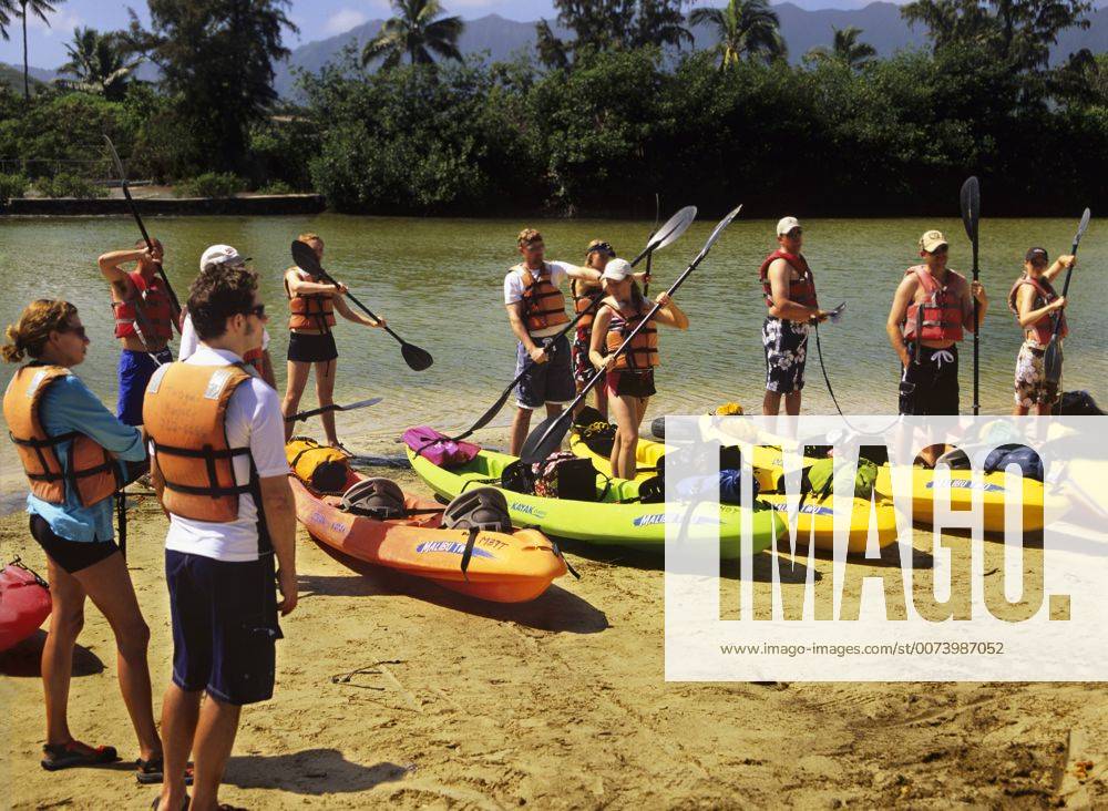 Kayaks and kayakers getting their first lesson in Kane ohe on the North