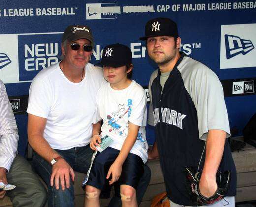 Richard Gere and son Homer visit with Yankees Joba Chamberlain before  yesterday s game against the