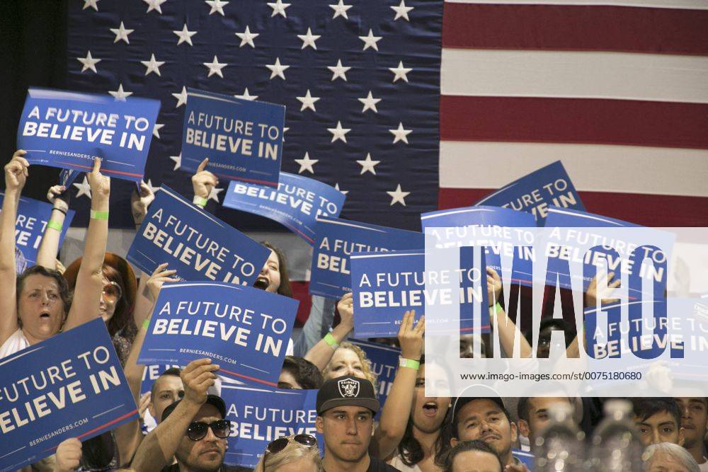 A crowd of Bernie Sanders supporters cheering at a rally in Phoenix ...