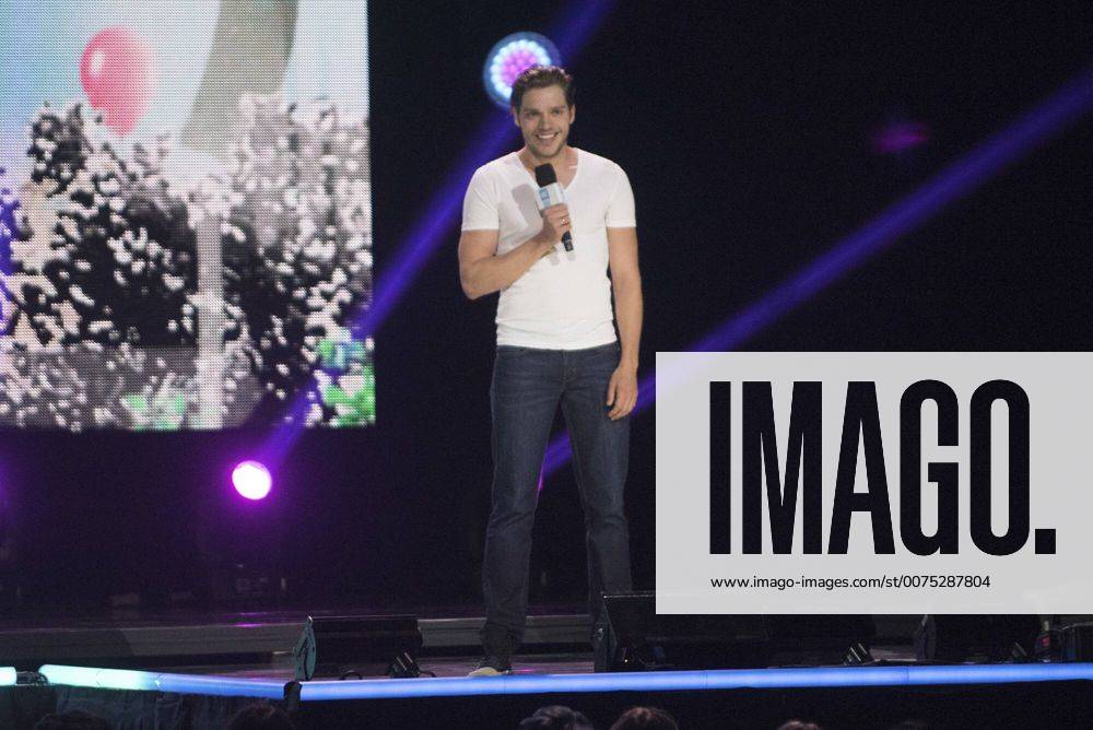 Dominic Sherwood addresses the crowd at WE Day Seattle in Key Arena