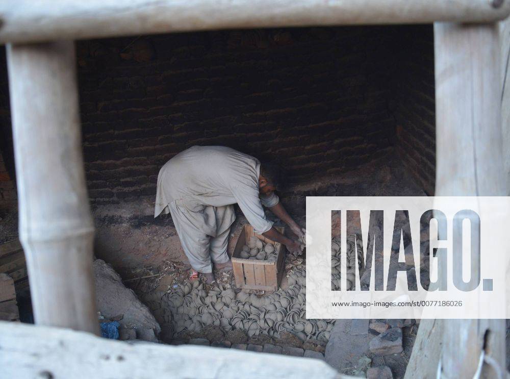 Lahore Pakistani Artisan Preparing Clay Pot An artisan uses a pottery