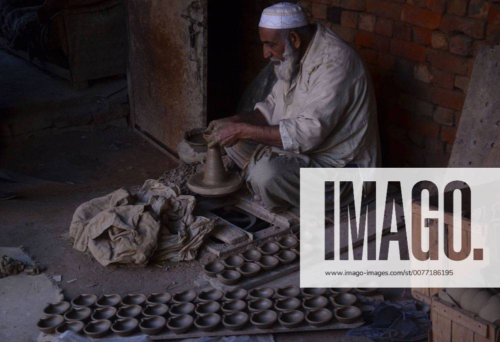 Lahore Pakistani Artisan Preparing Clay Pot An artisan uses a pottery