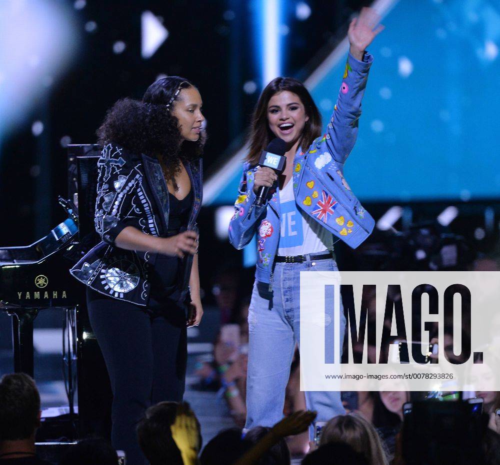 Singer Alicia Keys is joined onstage by show host Selena Gomez during ...